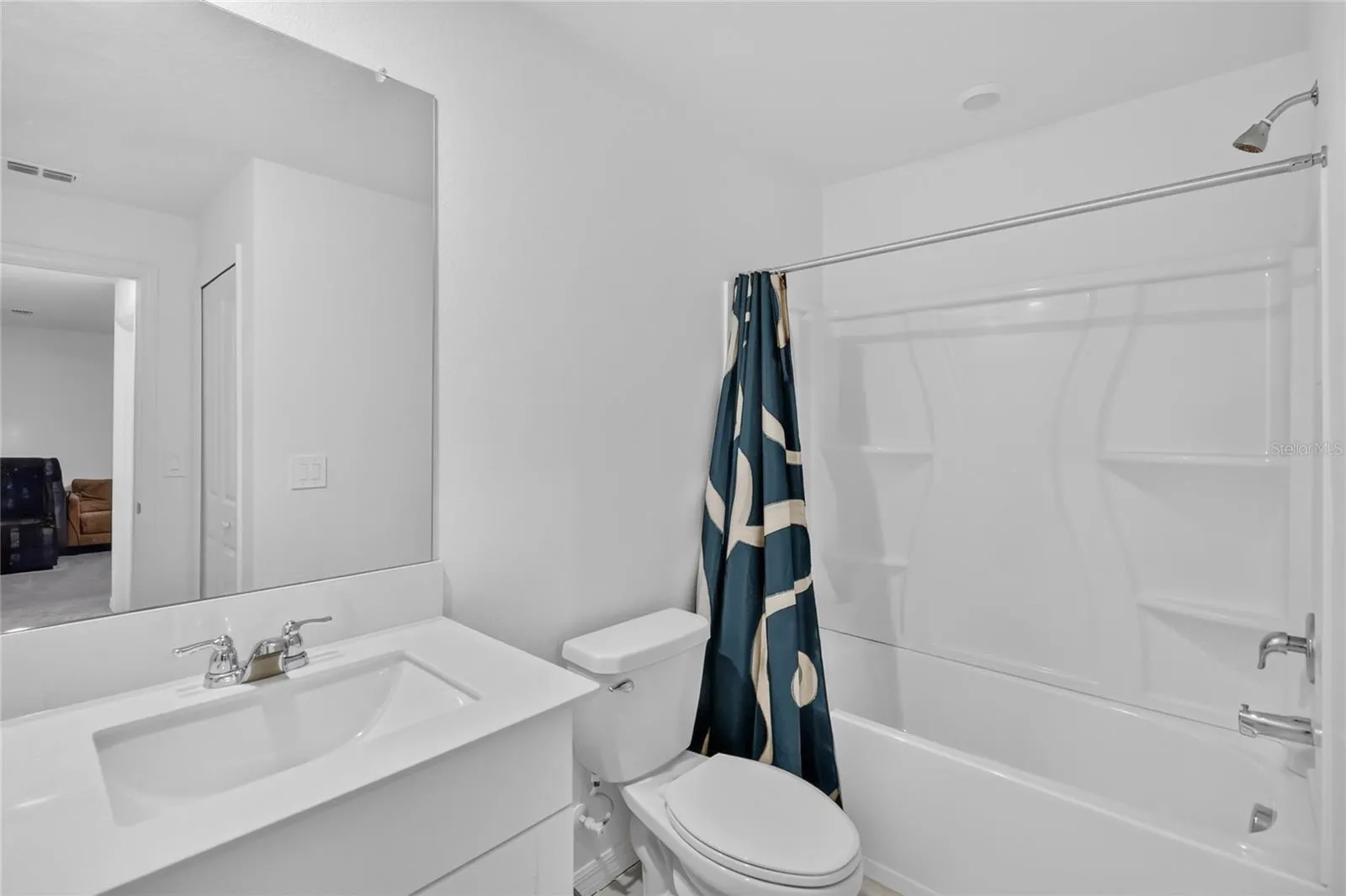 Another view of guest bathroom with tub/shower combo