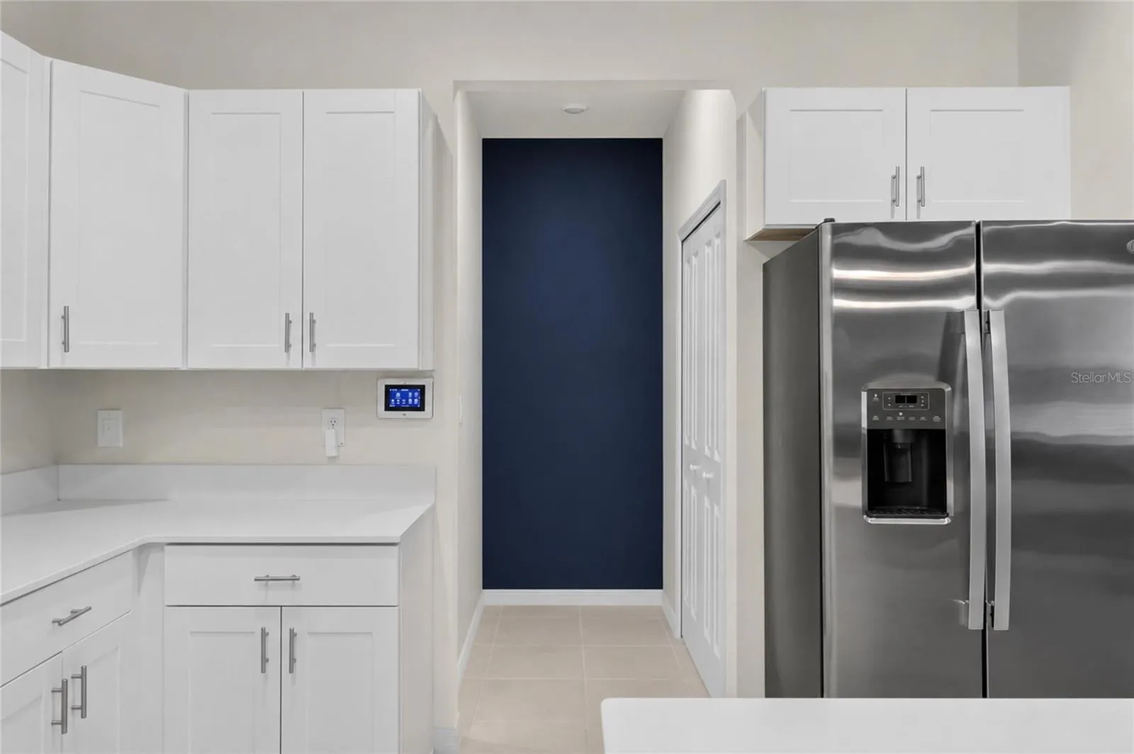 Kitchen hallway to garage/pantry and downstairs 1/2 bath