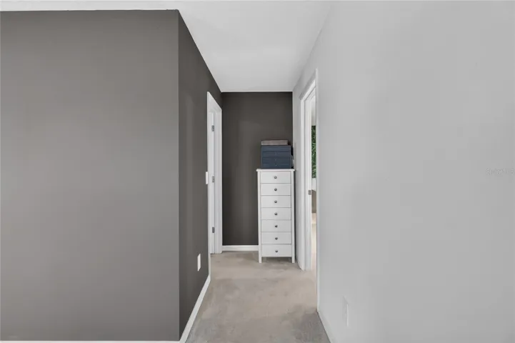 Hallway to primary bathroom