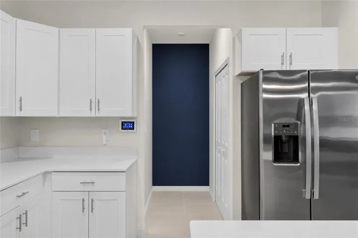 Kitchen hallway to garage/pantry and downstairs 1/2 bath