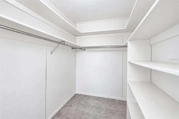 Spacious walk-in closet with built-in shelving