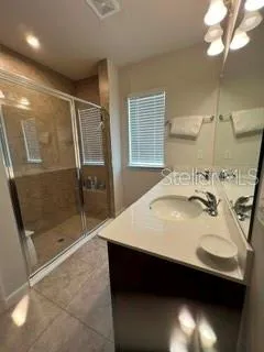 Primary Ensuite Bathroom has dual sinks, Quartz Countertops, and nice oversized walk-in shower.