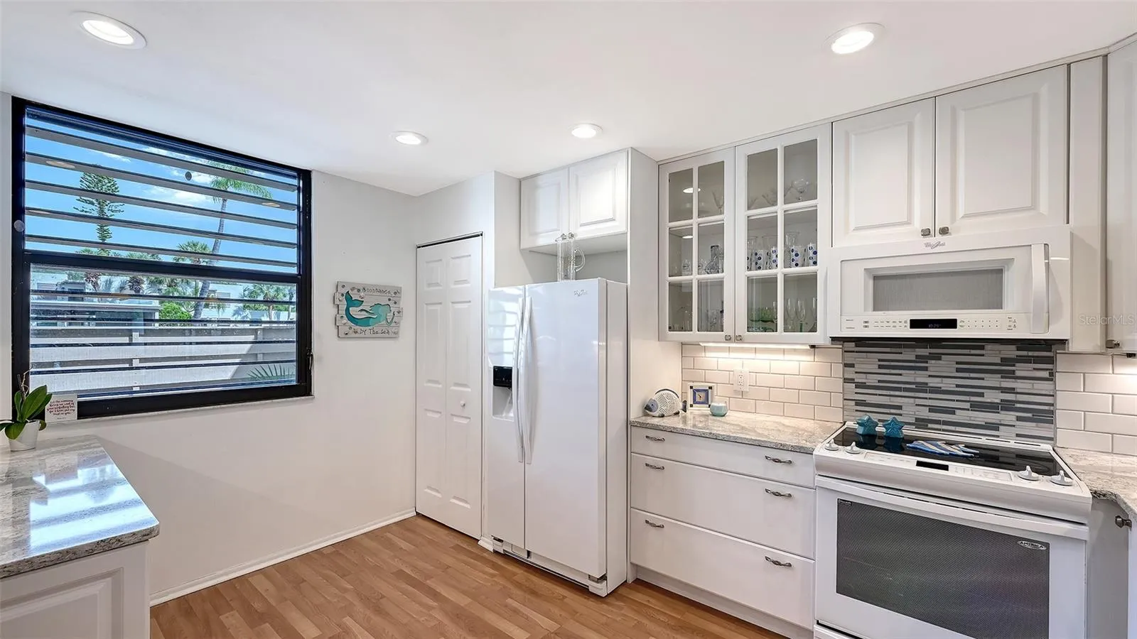 The large window in the back of the kitchen means plenty of natural light for the kitchen