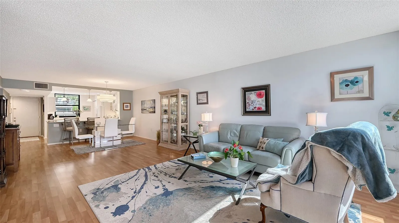 Another view of living room and dining room. most furnishings are available for purchase outside of closing.