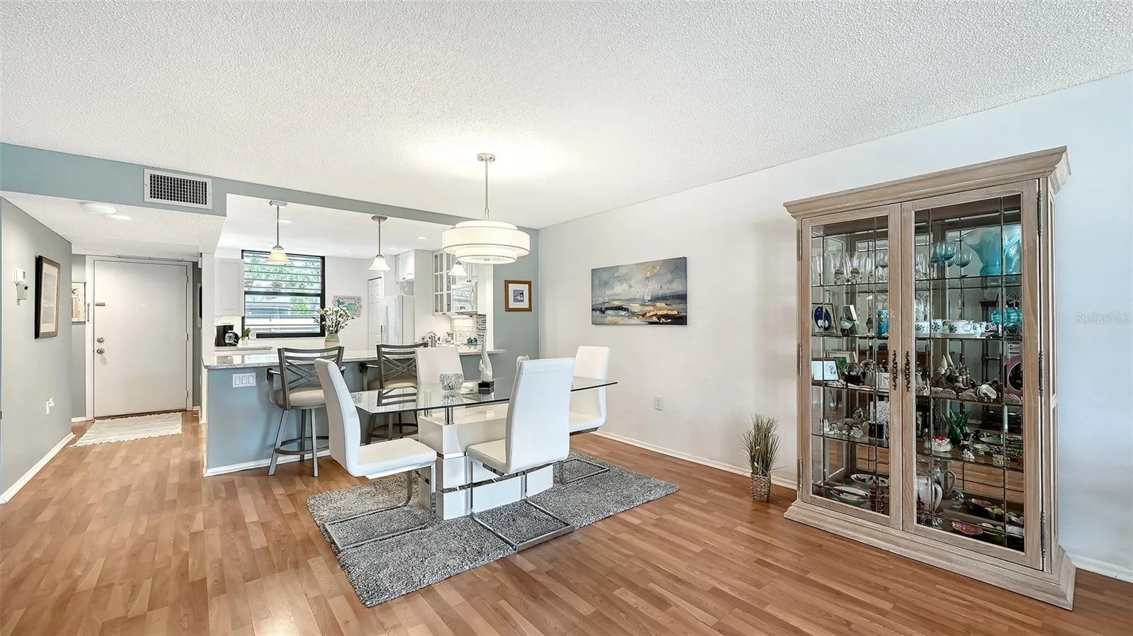 The extension of the living area into the lanai creates extra elbow room in the dining room.