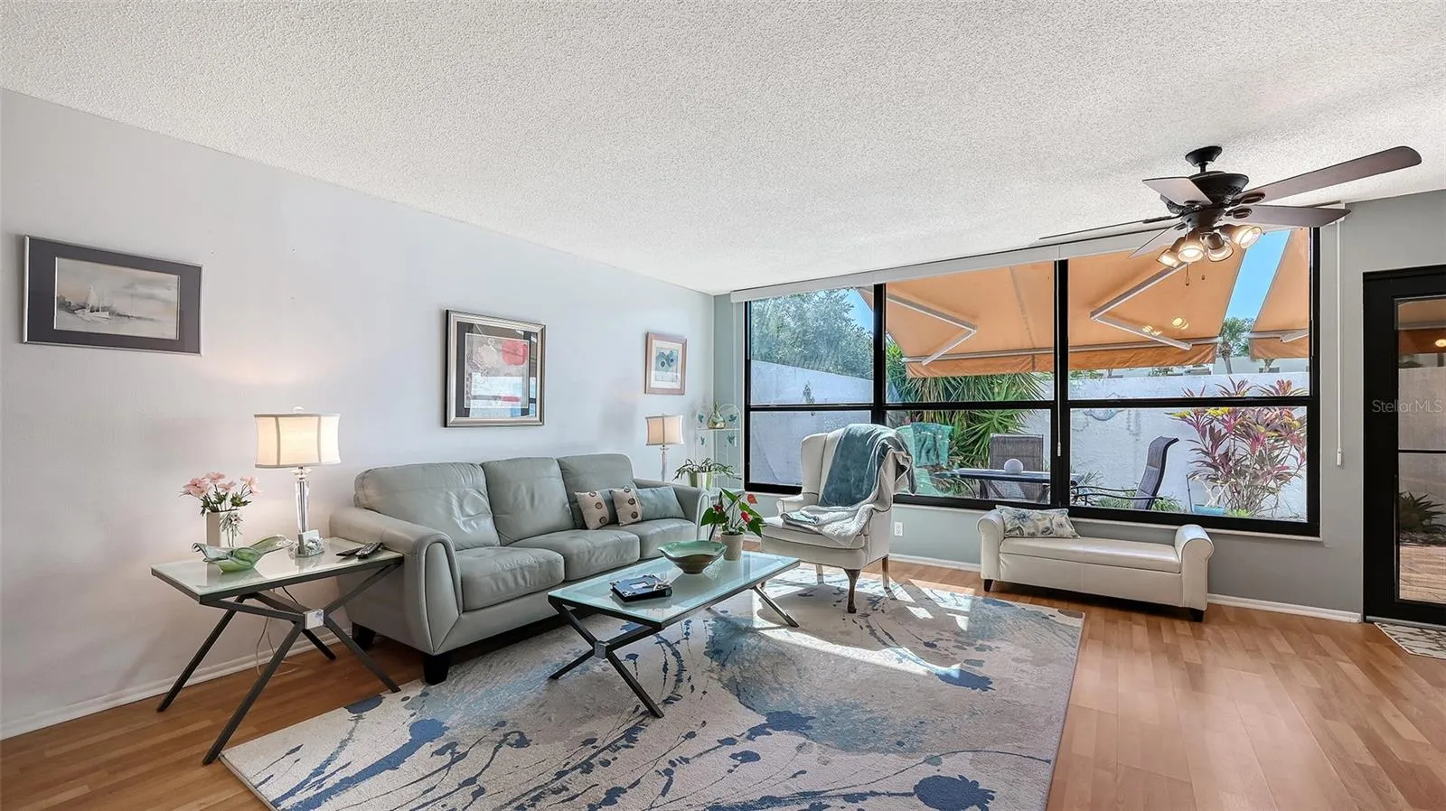 Living room extend into former lanai. Adds about 10 feet to end of living room