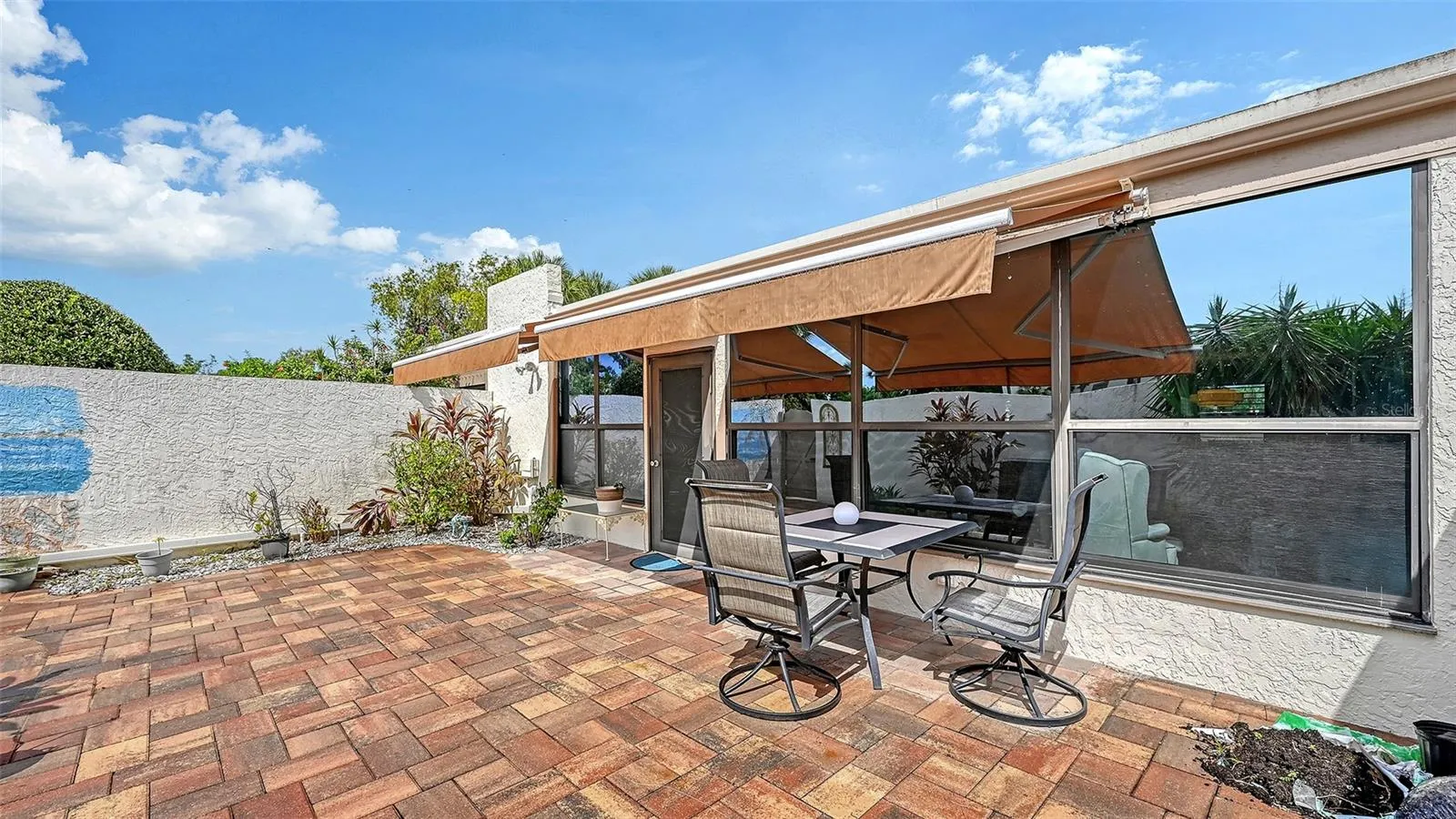 You dont have to give up your private back yard if you buy this home. The courtyard is yours landscape as you wish (larger trees may need association approval). Great for outdoor cooking. Also a huge plus if you are a dog owner- a lockable gate makes if fully enclosed and secure. The walls are 6'+ high.