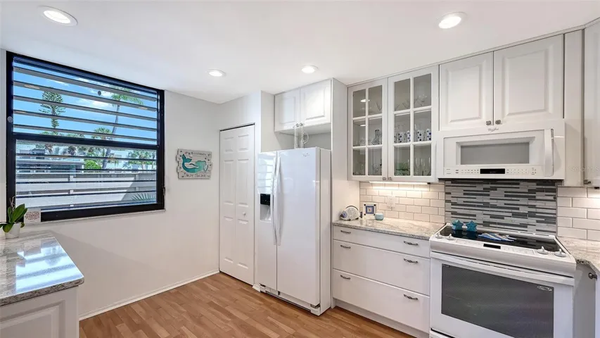 The large window in the back of the kitchen means plenty of natural light for the kitchen
