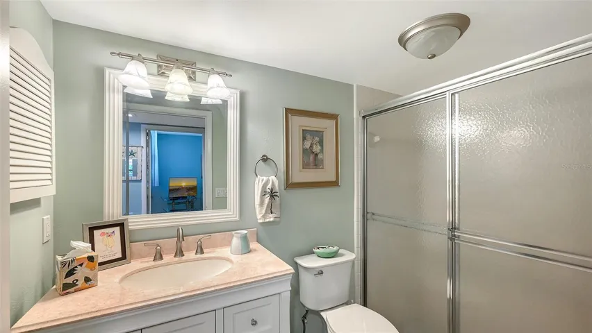 Guest bath is accessible without passing through the guest bedroom.