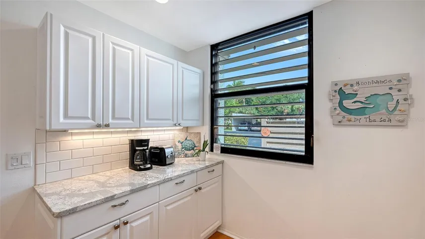 The efficient kitchen offers plenty of storage as well as extra countertop space