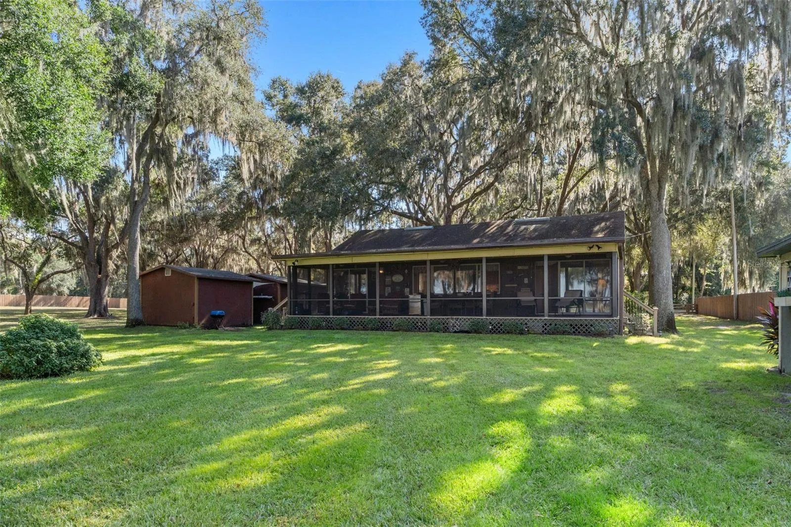 MASSIVE SCREENED PORCH OVERLOOKING THE LAKE