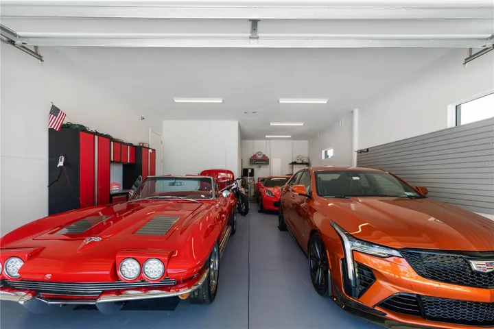Bring your cars! Finished garage space designed for three cars with higher ceilings and electric for future lifts.