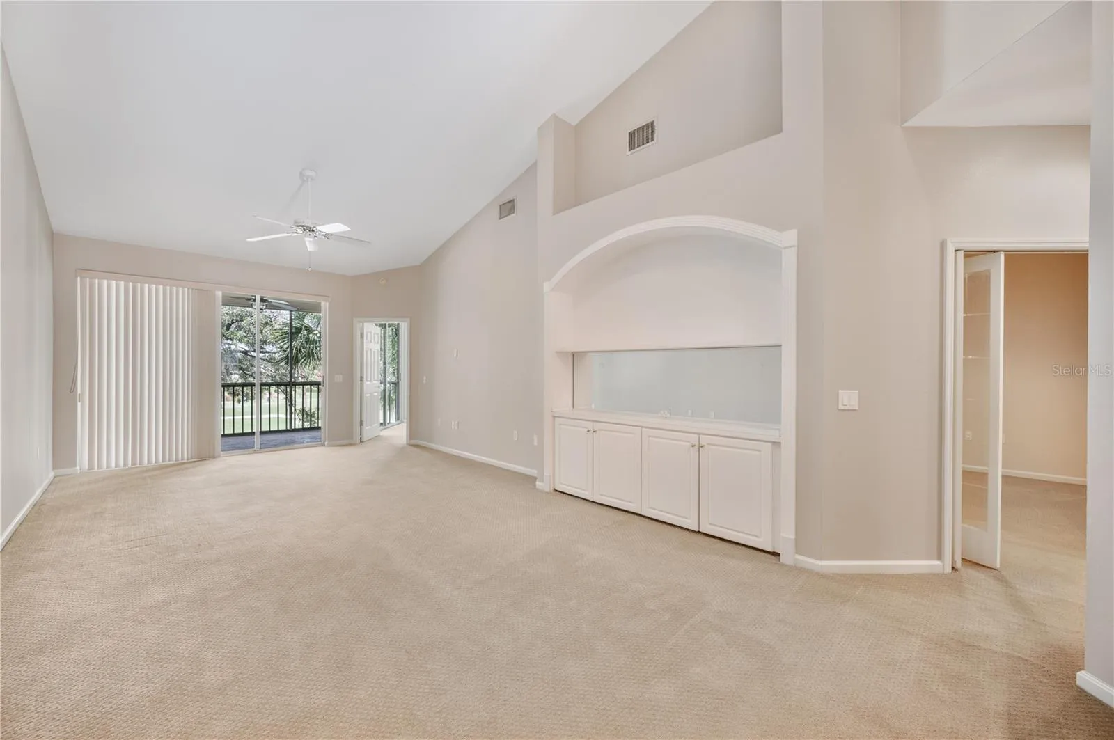Living room and Dining room  with sliding glass doors to screened in lanai