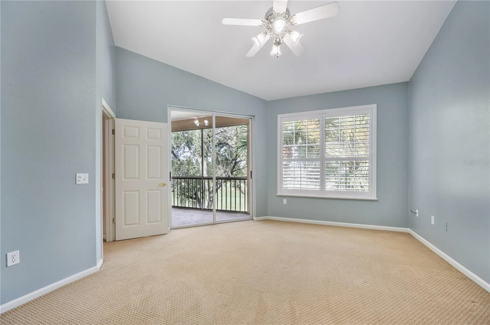 Primary Bedroom with access to screened in lanai