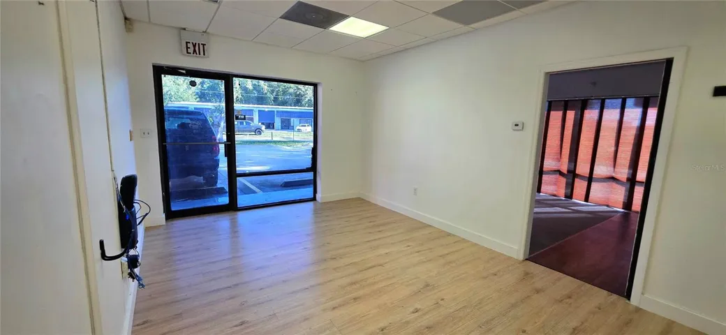 View of the front glass door and doorway to the 2nd office