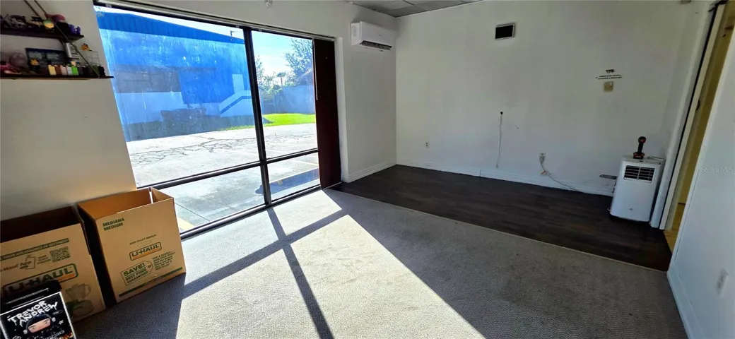 Corner office with tinted floor to ceiling windows and lots of natural light