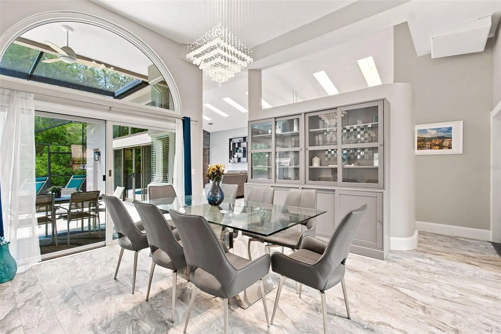 Formal dining room overlooking pool
