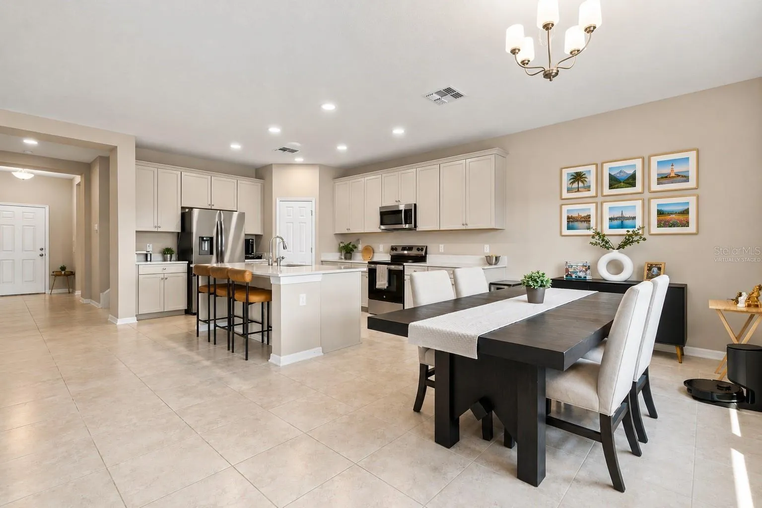 Photos virtually Staged Integrated entertainment with living, dining, and kitchen