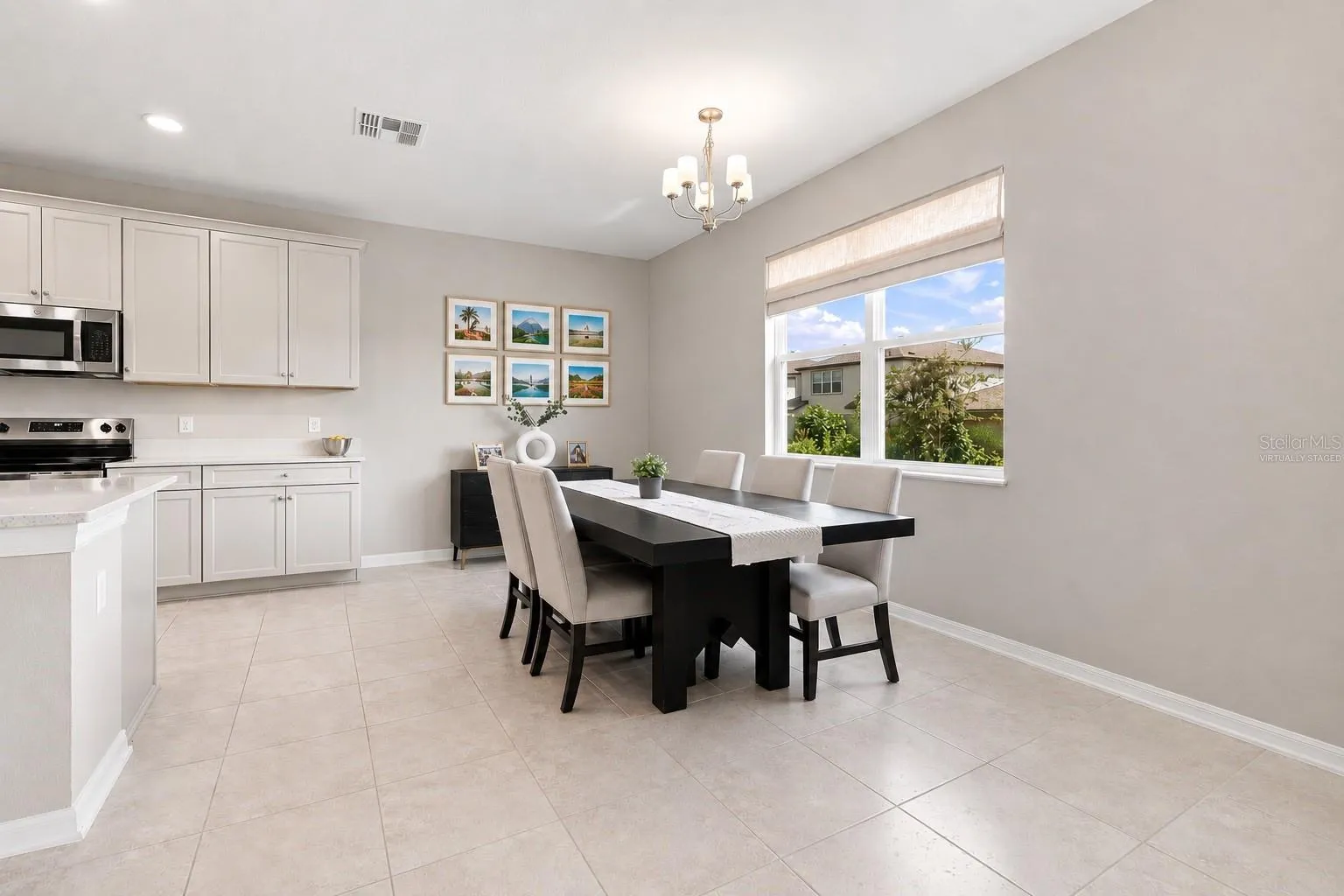 Photos virtually Staged Large windows let in the sunlight.
