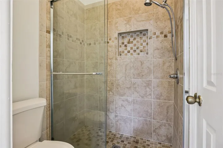 Upstairs shower with dual access