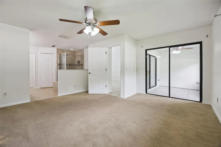Primary bedroom with access to patio/lanai