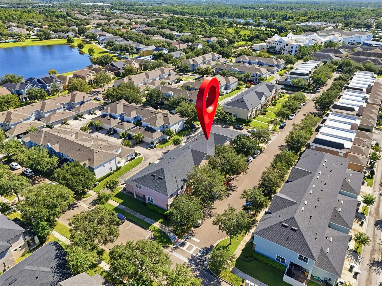 Aerial view of the townhome and surrounding neighborhood