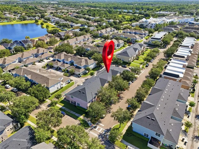 Aerial view of the townhome and surrounding neighborhood