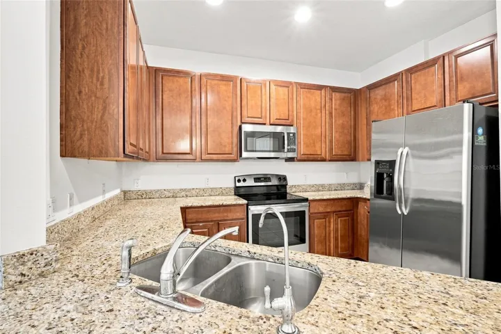 Kitchen with granite countertops and stainless-steel appliances