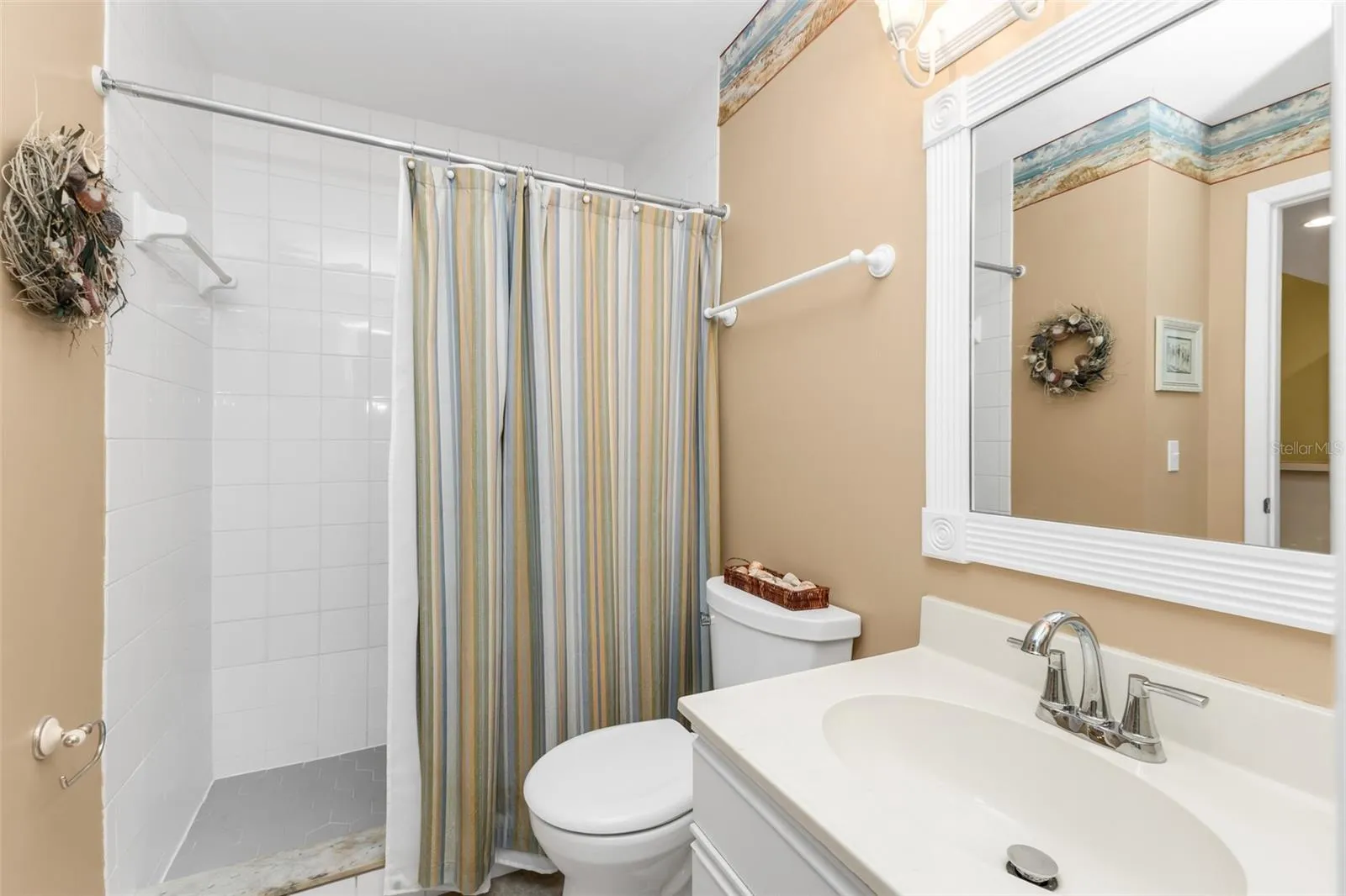 Guest bath off the hallway with walkin shower only.