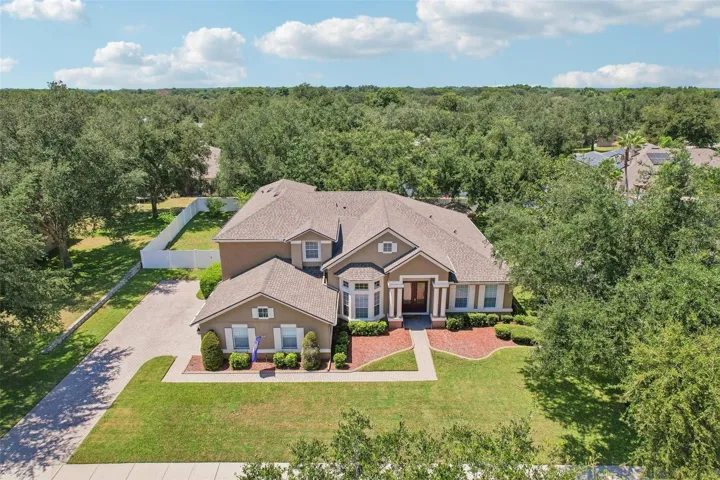Situated on a large .39 ACRE ~ FULLY FENCED LOT, this spacious home offers 5-BEDROOM POTENTIAL, 4 FULL BATHS, a dedicated OFFICE, upstairs LOFT, THEATER/MEDIA ROOM and 3-CAR SIDE-ENTRY GARAGE!
