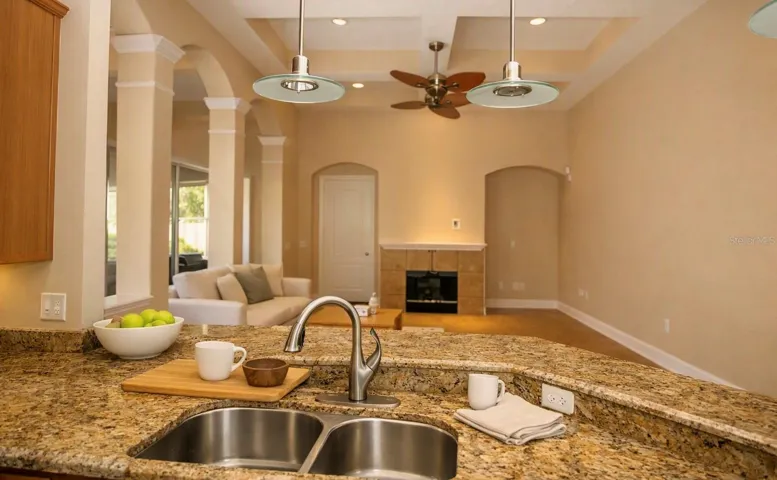 KITCHEN OVERLOOKING INTO FORMAL LIVING ROOM