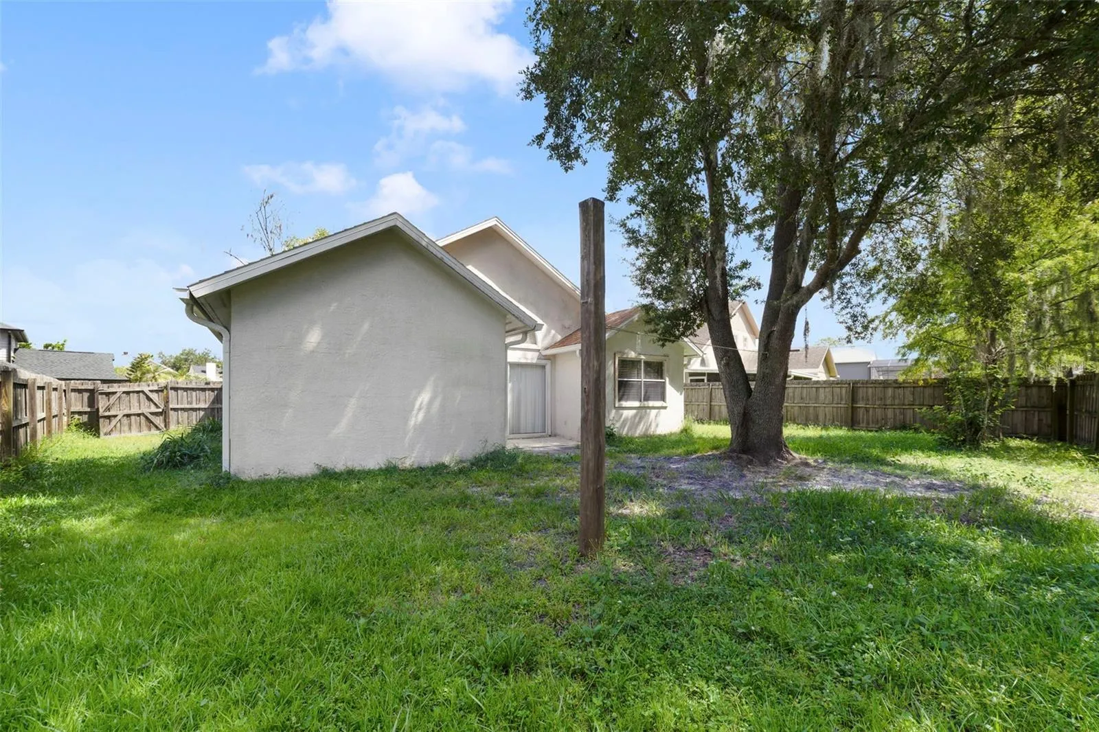 RECENT UPDATES provide valuable peace of mind, including a NEW ROOF (2023), RE-PIPED PLUMBING (2024), NEW WATER HEATER (2025) and NEW WOOD FENCE (2017).