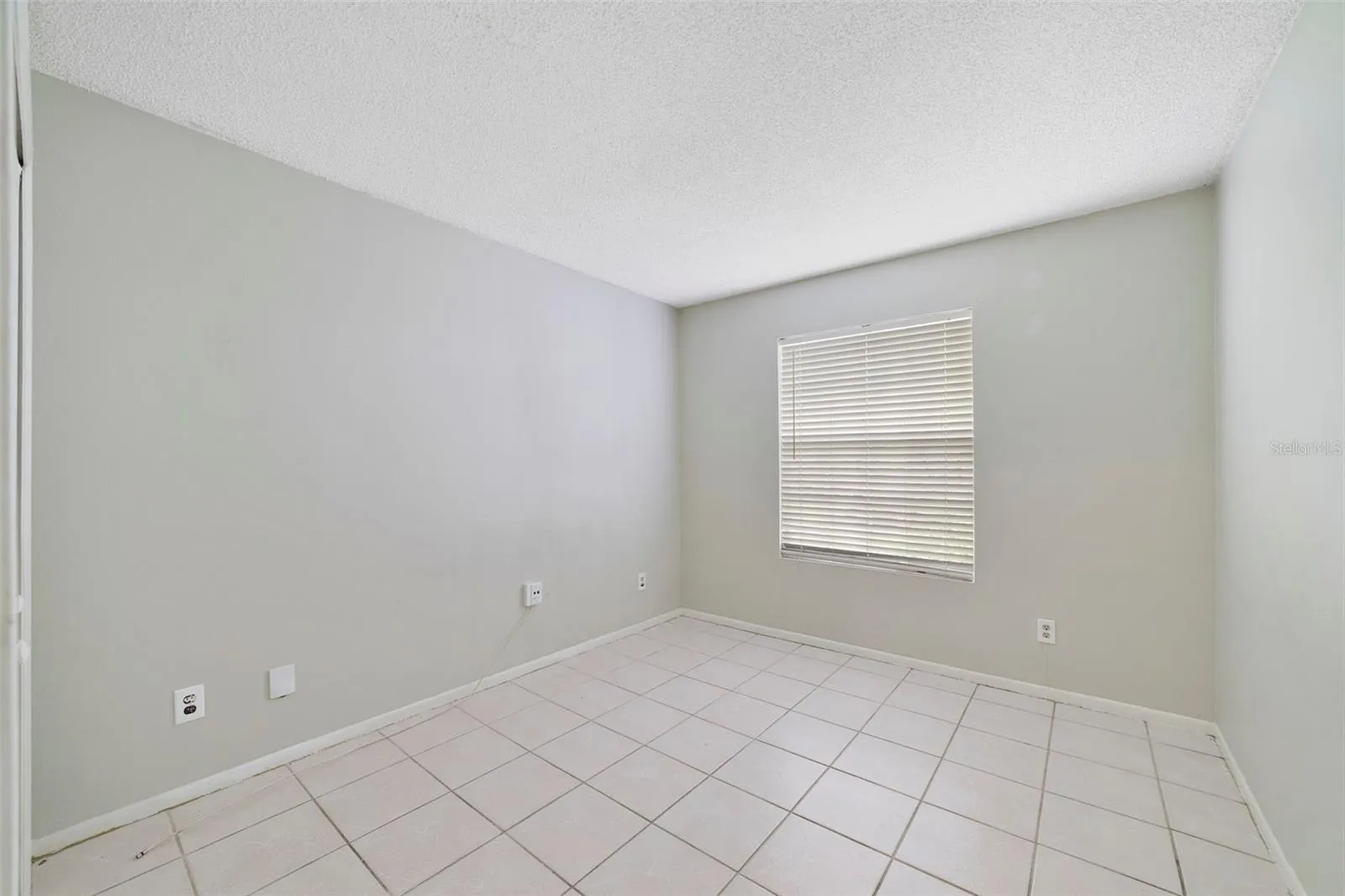 Bedroom 2 offers flexibility for use as a guest room, home office or hobby space.