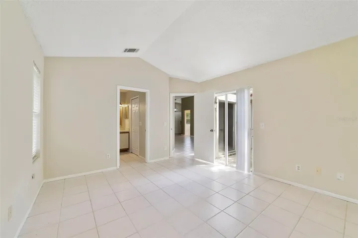 The desirable SPLIT-BEDROOM FLOOR PLAN provides privacy for the Primary Suite, which is tucked away from the secondary bedrooms and features its own DIRECT ACCESS to the back patio and yard.