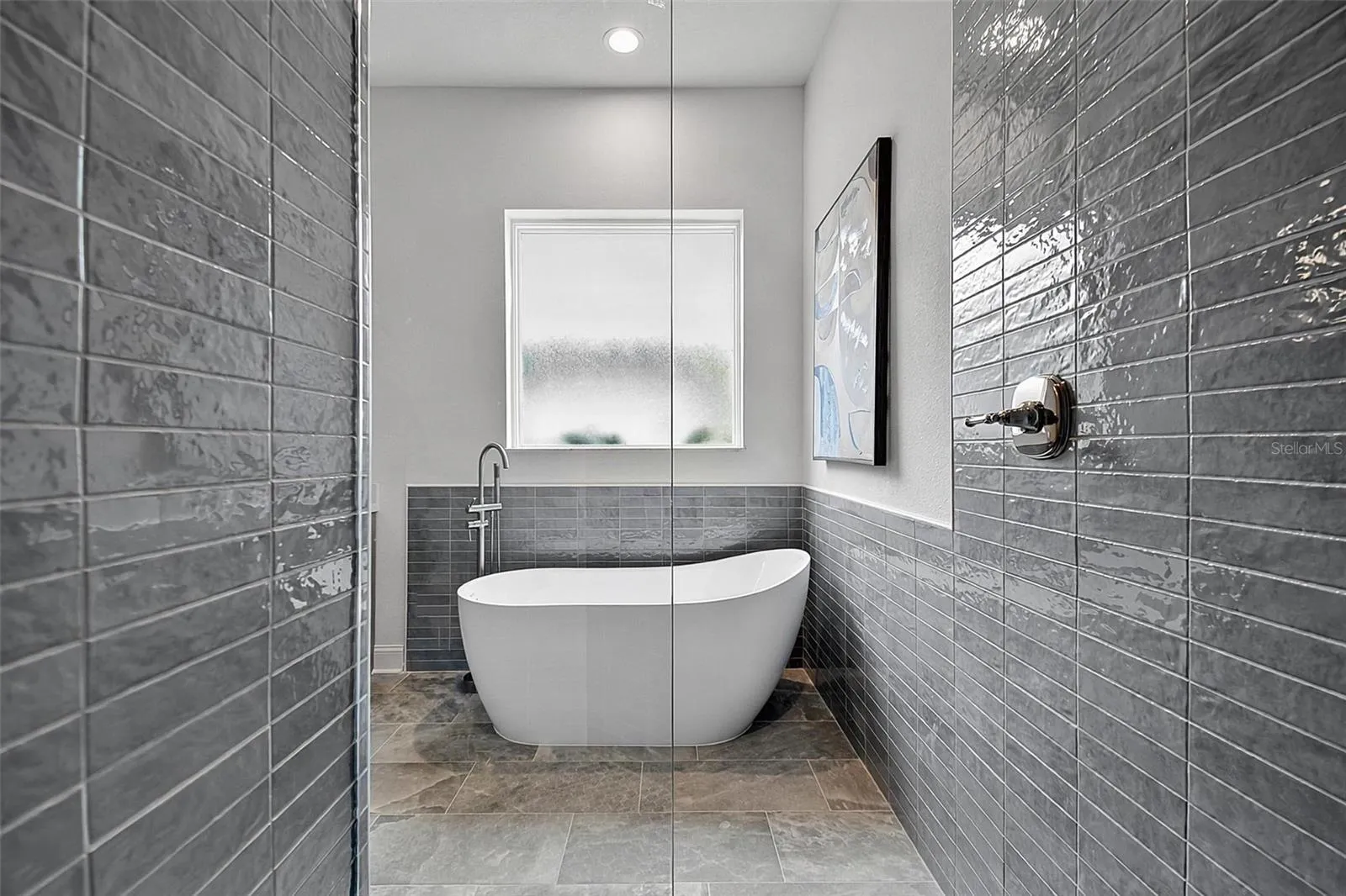 This is a look at the freestanding soaking tub from the tiled shower