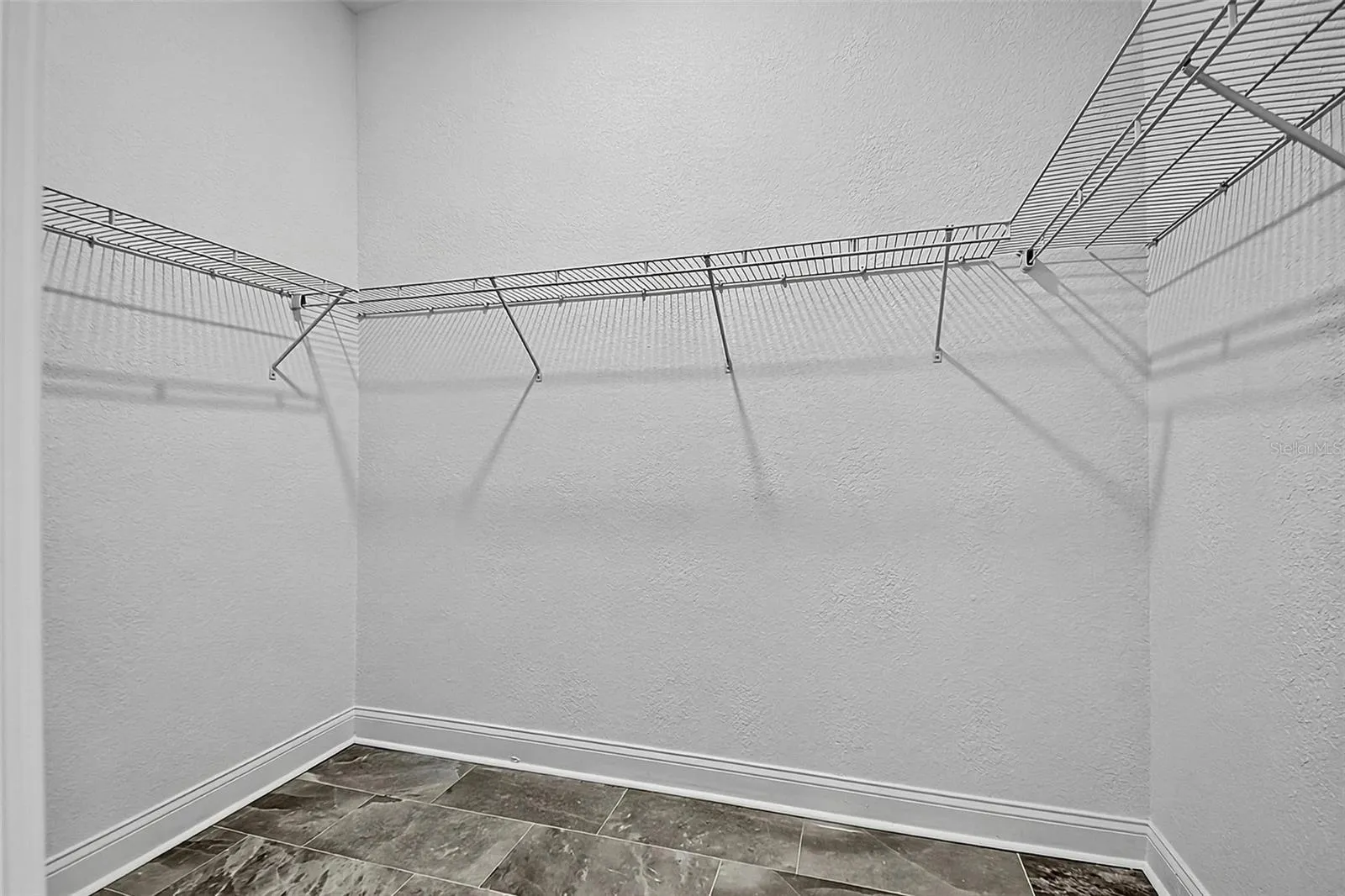 Walk-in closed with shelving for storage and hang up space