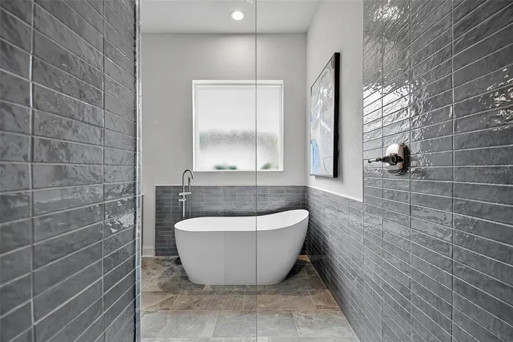 This is a look at the freestanding soaking tub from the tiled shower