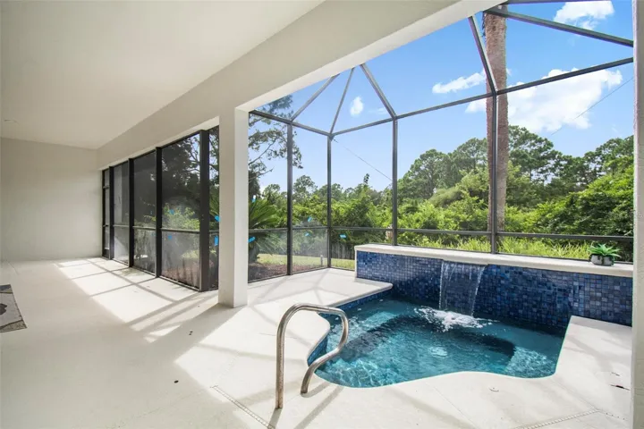 The spool with water feature looks out tot he private backyard