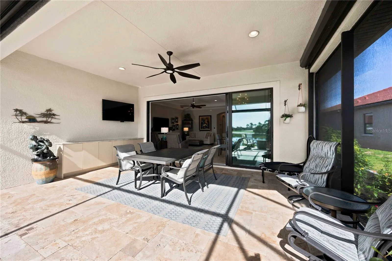 The travertine lanai is stunning.  A fabulous spot to relax. Extensive outdoor cabinets help keep you organized in the outdoor environment.