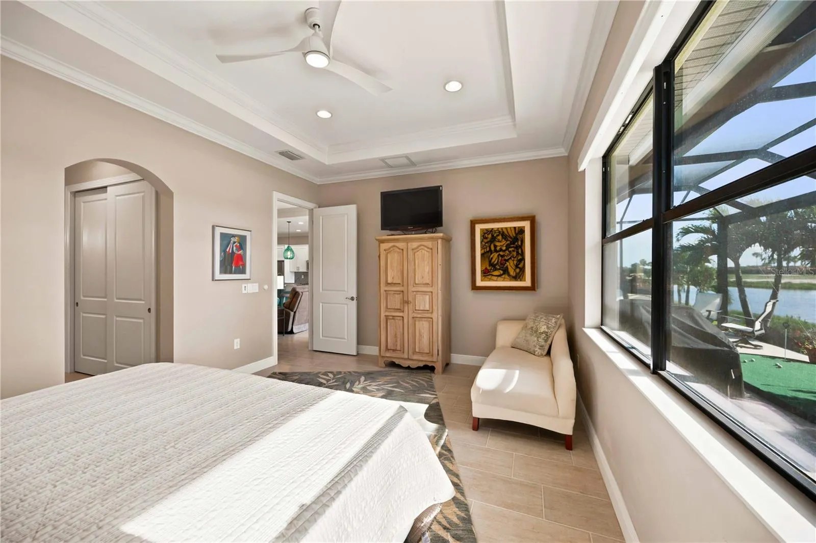 The primary bedroom is large and has lots of light overlooking the water - tile throughout.