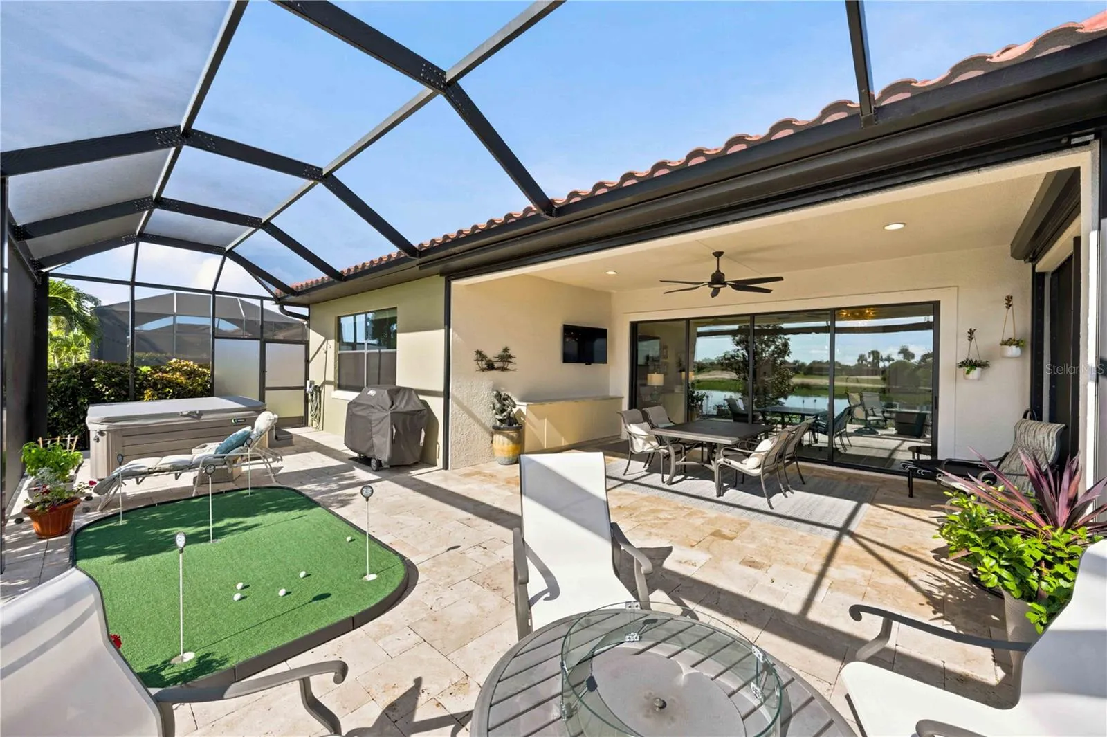 The travertine lanai is stunning.  A fabulous spot to relax. Extensive outdoor cabinets help keep you organized in the outdoor environment