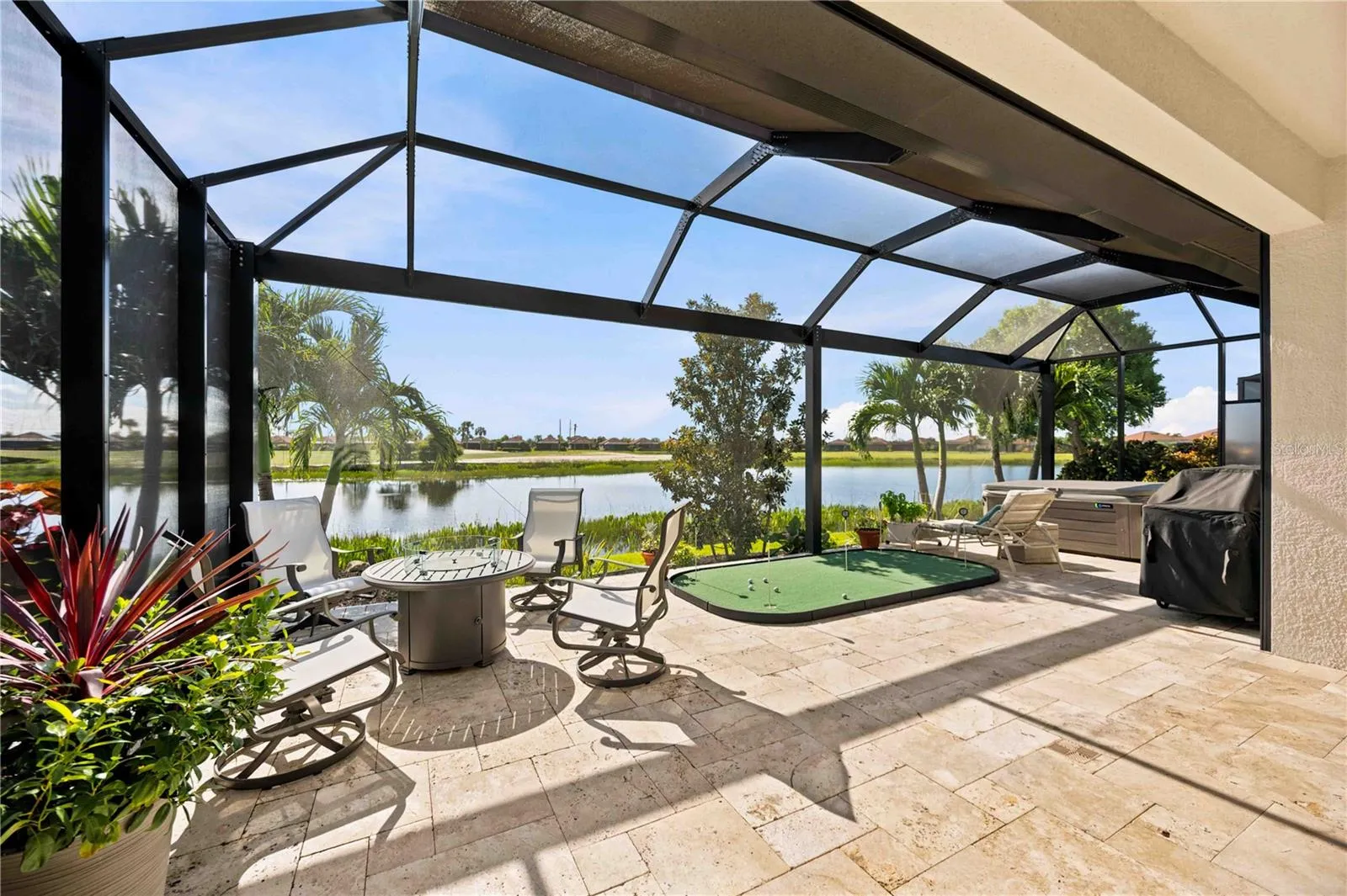 The travertine lanai is stunning.  A fabulous spot to relax. Extensive outdoor cabinets help keep you organized in the outdoor environment
