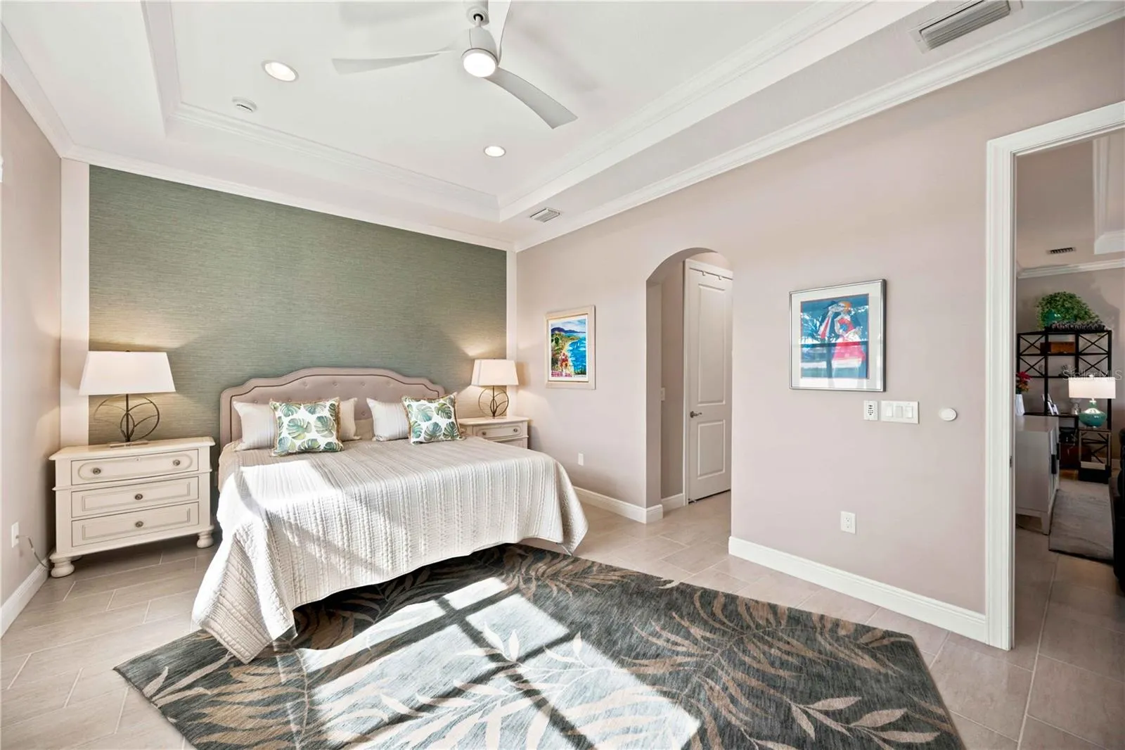 The primary bedroom is large and has lots of light overlooking the water - tile throughout.
