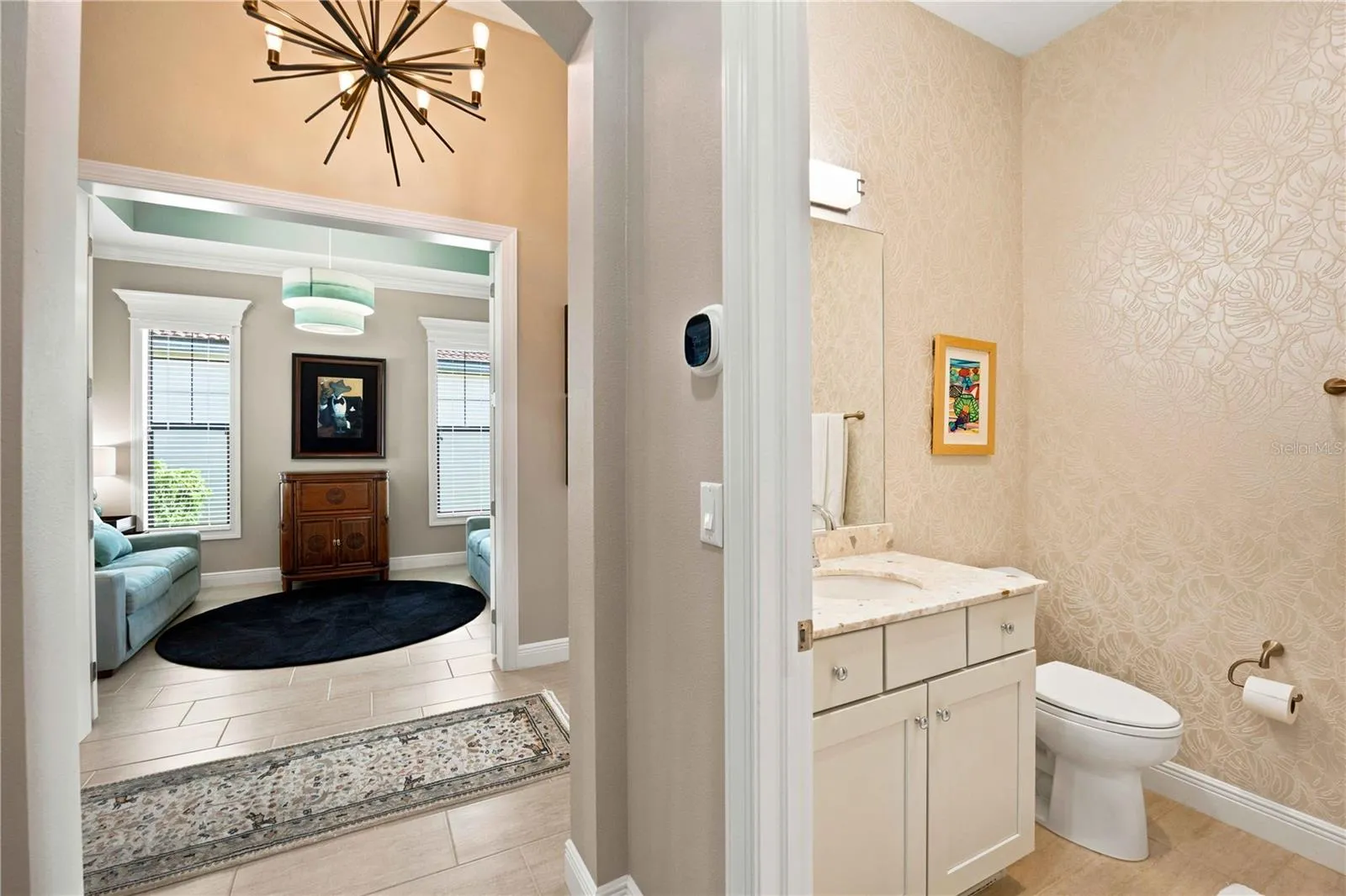 There is a full bath off the front entry - easy for guests and easy for the two bedrooms in this area of the home.