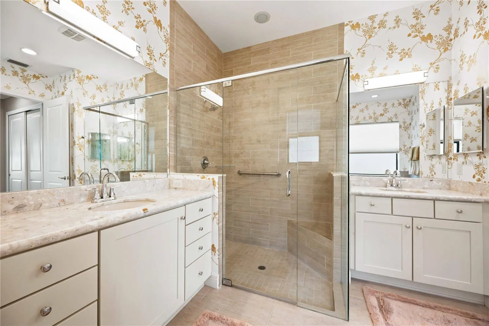 The primary ensuite has dual vanities, a large walk in shower, a soaking tub and private water closet.