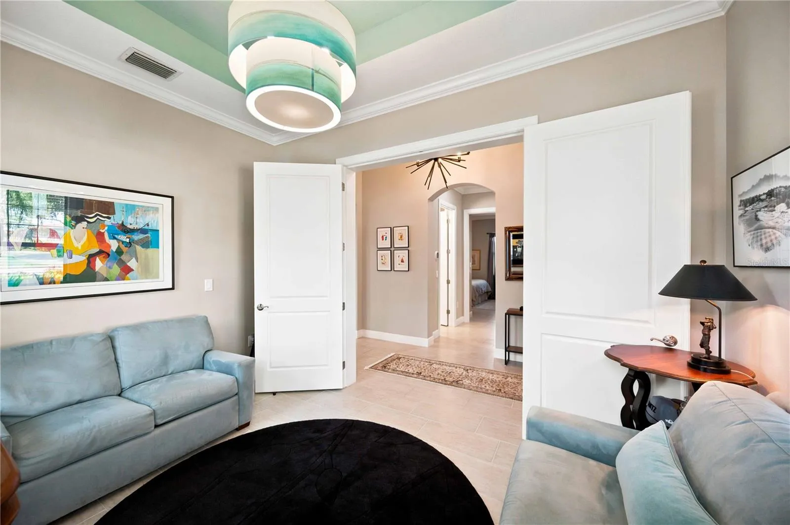 Den showcasing twin french wood doors - light does not convey