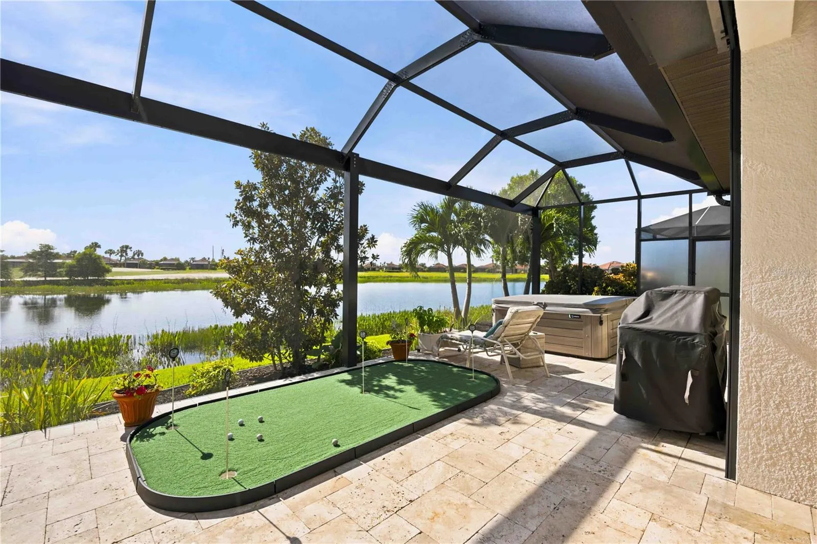 The travertine lanai is stunning.  A fabulous spot to relax. Extensive outdoor cabinets help keep you organized in the outdoor environment