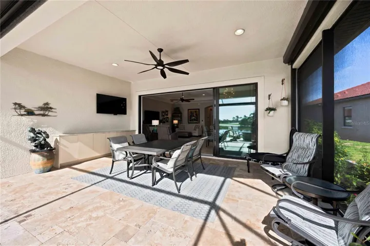The travertine lanai is stunning.  A fabulous spot to relax. Extensive outdoor cabinets help keep you organized in the outdoor environment.