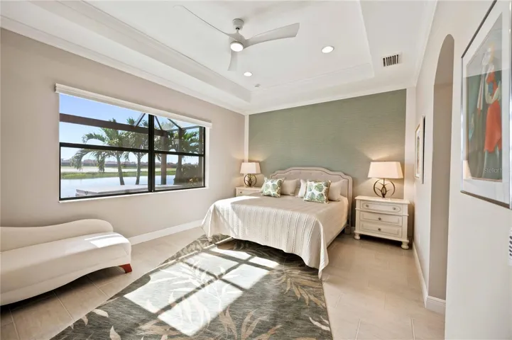 The primary bedroom is large and has lots of light overlooking the water - tile throughout.