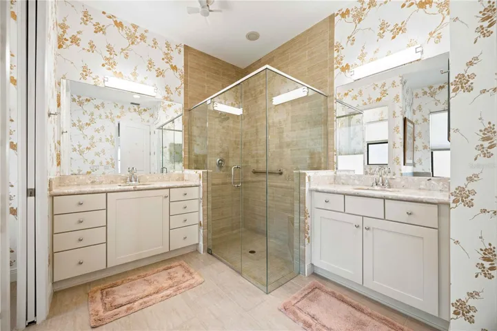 The primary ensuite has dual vanities, a large walk in shower, a soaking tub and private water closet.
